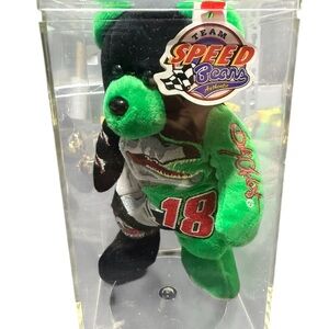 Green and Black Stuffed Animal